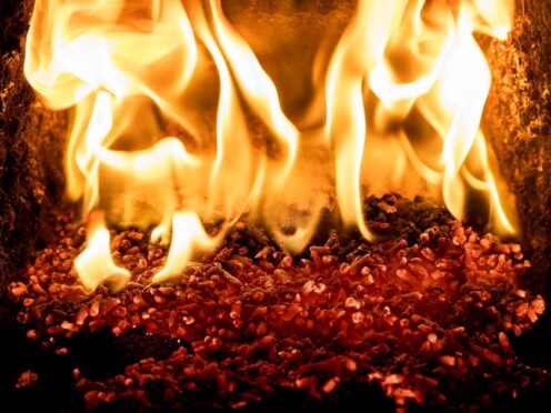 Pellets burning inside a biomass boiler (Liam McBurney/PA)