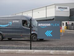 Electric delivery vans leave the Amazon warehouse in the Titanic Quarter, Belfast (Niall Carson/PA)