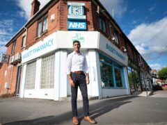 Rishi Sunak during a visit to his family’s old business, Bassett Pharmacy, in Southampton in 2022 (Stefan Rousseau/PA)