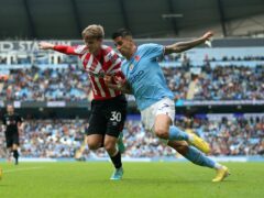 Brentford’s Mads Roerslev and Manchester City’s Joao Cancelo (right) (PA)