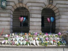 Flowers on the steps of Nottingham Council House (PA)