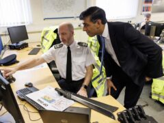 Prime Minister Rishi Sunak speaks to Police Sergeant Gavin Tuck while visiting Harlow Police Station in Essex (Dan Kitwood/PA)