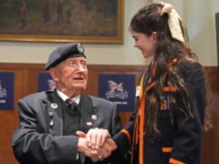 D-Day veteran and ambassador for the British Normandy Memorial Stan Ford, 98, who served with the Royal Navy, meeting a pupil from Norfolk House School (Gareth Fuller/PA)
