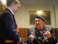 D-Day veterans Richard Aldred, 99, who served with the 7th Armoured Division of Royal Tank Regiment, meeting pupils from Norfolk House School (Gareth Fuller/PA)