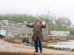 Nigel Farage poses for photographers in Dover (Gareth Fuller/PA)
