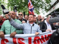 Tommy Robinson, whose real name is Stephen Yaxley Lennon, leads a protest march through London (David Parry/PA)
