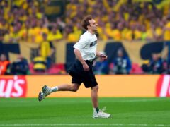 A pitch invader during the UEFA Champions League final at Wembley (Joe Giddens/PA)
