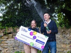Graeme White and his wife Katherine after their £1 million win on EuroMillions (Chris Ratcliffe/National Lottery/PA)