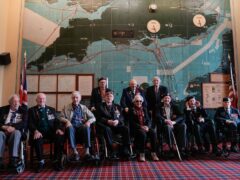 Normandy veterans pose for a photograph in the Map room at Southwick House (Andrew Matthews/PA)