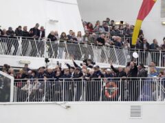 Normandy veterans wave from on board the Brittany Ferries ship Mont St Michel (Andrew Matthews/PA)