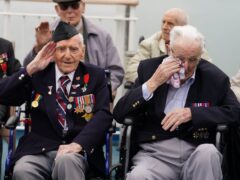 D-Day veteran Bernard Morgan (left), 100, from Crewe, salutes as Harry Birdsall, 98, from Wakefield, gets emotional as he travels on the Brittany Ferries ship Mont St Michel out of Portsmouth Harbour (Jordan Pettitt/PA)