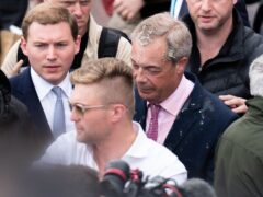 Leader of Reform UK Nigel Farage had a milkshake thrown over him as he left the Moon and Starfish pub after launching his General Election campaign in Clacton-on-Sea, Essex (James Manning/PA)