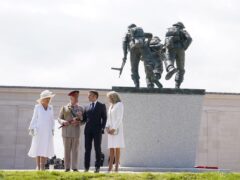 Queen Camilla, King Charles, President of France Emmanual Macron and Brigitte Macron stand beneath the D-Day Sculpture, following the UK national commemorative event for the 80th anniversary of D-Day (Gareth Fuller/PA)
