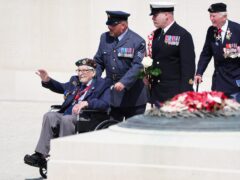 Veterans are escorted at the end of the UK national commemorative event for the 80th anniversary of D-Day (Jane Barlow/PA)
