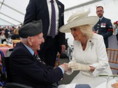 Queen Camilla speaks with RAF D-Day veteran Bernard Morgan, 100 during a lunch following the UK national commemorative event for the 80th anniversary of D-Day in Normandy (Gareth Fuller/PA)