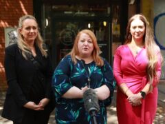 Alliance Party candidates Sorcha Eastwood (right) standing in Lagan Valley, party leader Naomi Long (centre) standing in East Belfast and Kate Nicholl standing in South Belfast, outside the Electoral Office for Northern Ireland in Belfast (Liam McBurney/PA)