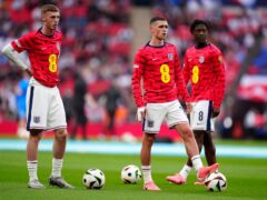 England’s Cole Palmer, Phil Foden and Kobbie Mainoo warming up before the friendly against Iceland (Mike Egerton/PA)
