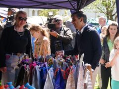 Prime Minister Rishi Sunak talking to a person at a village fete while on the General Election campaign trail (PA)