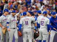 New York Mets catcher Luis Torrens (centre, rear) is congratulated by his team-mates after making a double play to finish the match (Zac Goodwin/PA)