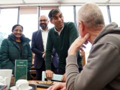 Prime Minister Rishi Sunak talking to locals at a cafe in Squires Garden Centre in Crawley, West Sussex (Gareth Fuller/PA)