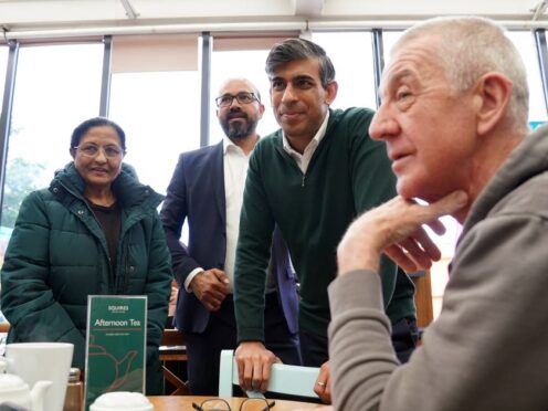 Prime Minister Rishi Sunak talking to locals at a cafe in Squires Garden Centre in Crawley, West Sussex, while on the General Election campaign trail (Gareth Fuller/PA)