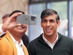 Prime Minister Rishi Sunak (right) has a selfie taken with a local at a cafe in Squires Garden Centre in Crawley, West Sussex, while on the General Election campaign trail (Gareth Fuller/PA)