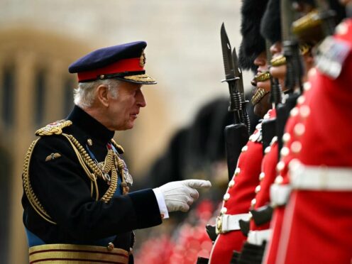 The King presented new colours to No 9 and No 12 Companies of the Irish Guards, during a ceremony at Windsor Castle (Ben Stansall/PA)