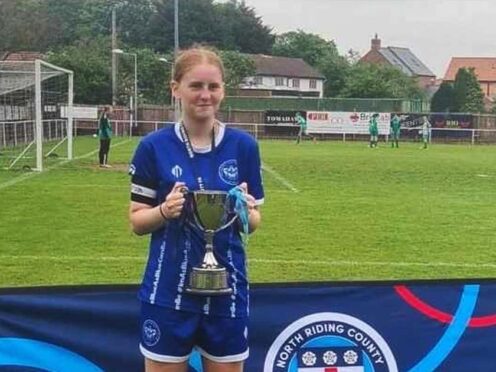 Lily Lucas, captain of Thornaby under 15s, lifting a trophy for the club (Family handout/PA)