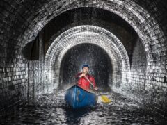 Canal & River Trust team leader Gordon McMinn canoes through Standedge Tunnel on the Huddersfield Narrow Canal (Danny Lawson/PA)