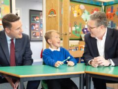 Shadow health secretary Wes Streeting (left) and Labour leader Sir Keir Starmer (right) talk about teeth at Whale Hill Primary School in Eston, Middlesbrough (Stefan Rousseau/PA)
