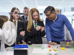 Prime Minister Rishi Sunak speaks to pupils in a science lesson during a visit to John Whitgift Academy in Grimsby (Dominic Lipinski/PA)