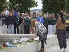 Floral tributes being laid during a memorial event at the University of Nottingham to mark the first anniversary of three people stabbed to death by Valdo Calocane (Joseph Raynor/Reach PLC/PA)