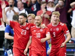 Christian Eriksen, centre, celebrates with team-mates after scoring Denmark’s opener (Nick Potts/PA)