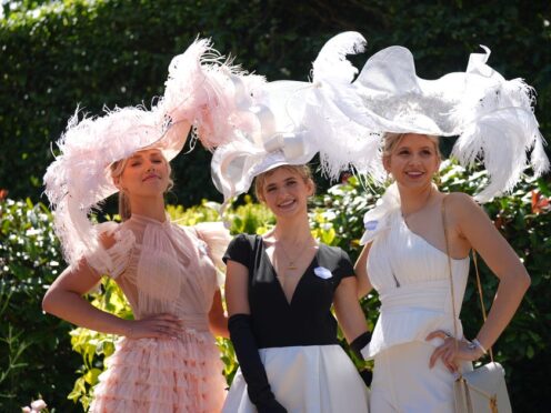 Racegoers put on the style on day three of Royal Ascot at Ascot Racecourse, Berkshire (Yui Mok/PA)