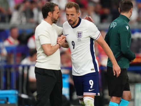 England’s Harry Kane shakes hands with manager Gareth Southgate after being substituted against Denmark. (Adam Davy/PA)