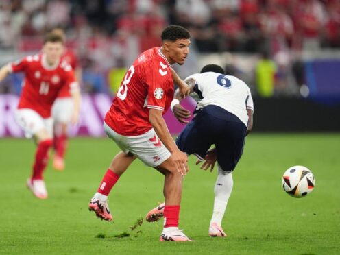 Denmark’s Alexander Bah and England’s Marc Guehi battle for the ball during the Euro 2024 match at the Frankfurt Arena (Adam Davy/PA)