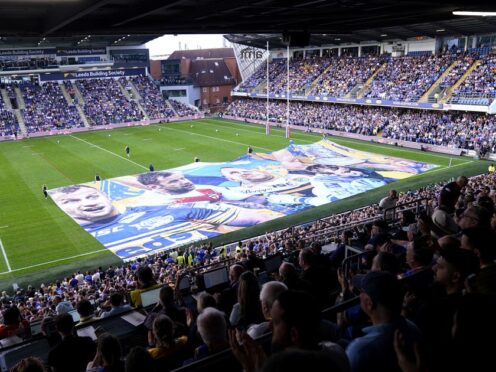 A large banner in tribute to Rob Burrow was displayed before the game (Danny Lawson/PA)