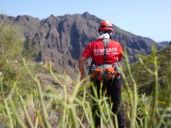A firefighter looks over the village of Masca, Tenerife, where the search for missing British teenager Jay Slater, 19, continues (James Manning/PA)