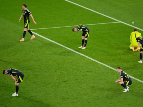 Scotland’s players show their dejection after losing 1-0 to Hungary, which ended their participation at Euro 2024 (Bradley Collyer/PA)