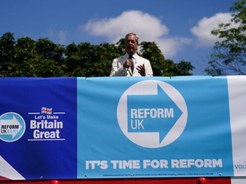 Reform UK leader Nigel Farage speaking on top of a double decker bus in Maidstone, Kent, during the election campaign trail (Jordan Pettitt/PA)