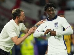 Will England manager Gareth Southgate hand Kobbie Mainoo (right) a start in the next game at Euro 2024? (Martin Rickett/PA)