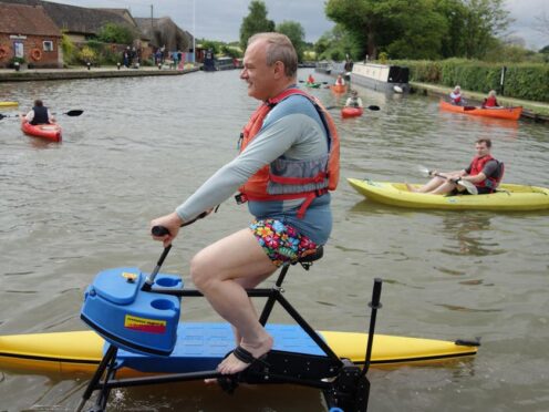 Liberal Democrat leader Sir Ed Davey uses an aqua-bike on the River Cherwell (Jacob Freedland/PA)