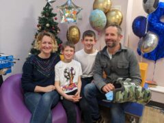 Vicki and James Woodall with their sons George and Alex celebrating five years of George being cancer free (Family handout/PA)