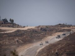 Israeli soldiers move near the Israeli-Gaza border (Leo Correa/AP)