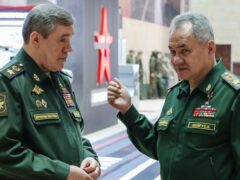 Russian former defence minister Sergei Shoigu and Chief of Staff General Valery Gerasimov are accused by the International Criminal Court of war crimes and inhumane acts (Sputnik/Kremlin Pool Photo/AP)