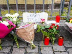 Flowers were left on the market square in Mannheim (Uwe Anspach/dpa via AP)