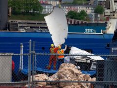 Debris from the Titan submersible, recovered from the ocean floor near the wreck of the Titanic, is unloaded from the ship Horizon Arctic at the Canadian Coast Guard pier in Newfoundland (Paul Daly/The Canadian Press via AP/File)
