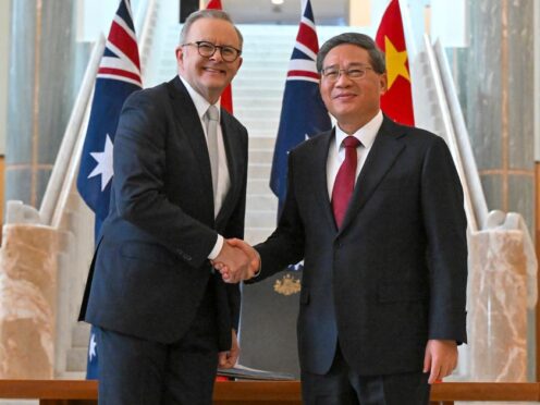 Chinese Premier Li Qiang and Australia’s Prime Minister Anthony Albanese shake hands at Parliament House in Canberra, Australia (Mick Tsikas/AP)