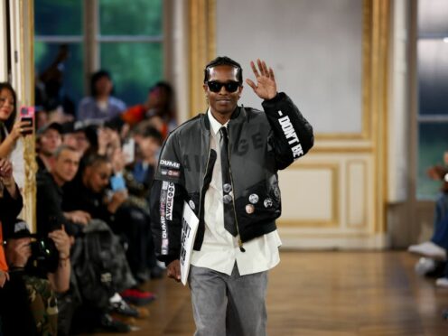 ASAP Rocky accepts applause after the American Sabotage spring summer collection show (Vianney Le Caer/Invision/AP)