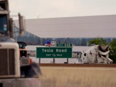 Vehicles pass the Tesla gigafactory in Austin, Texas (Eric Gay/AP)